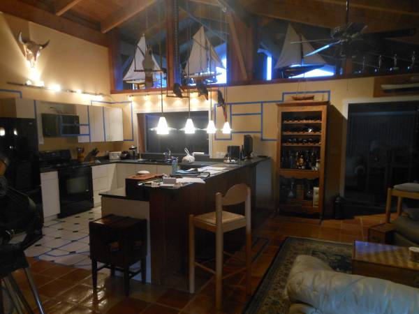 Keys Kitchen Kitchen before.  Blue tape outlines future cabinetry layout and new island design